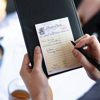 NCCO International - 3.5" x 5.125", 2-Part Small Paper Guest Check, 1000/Pk - 23516